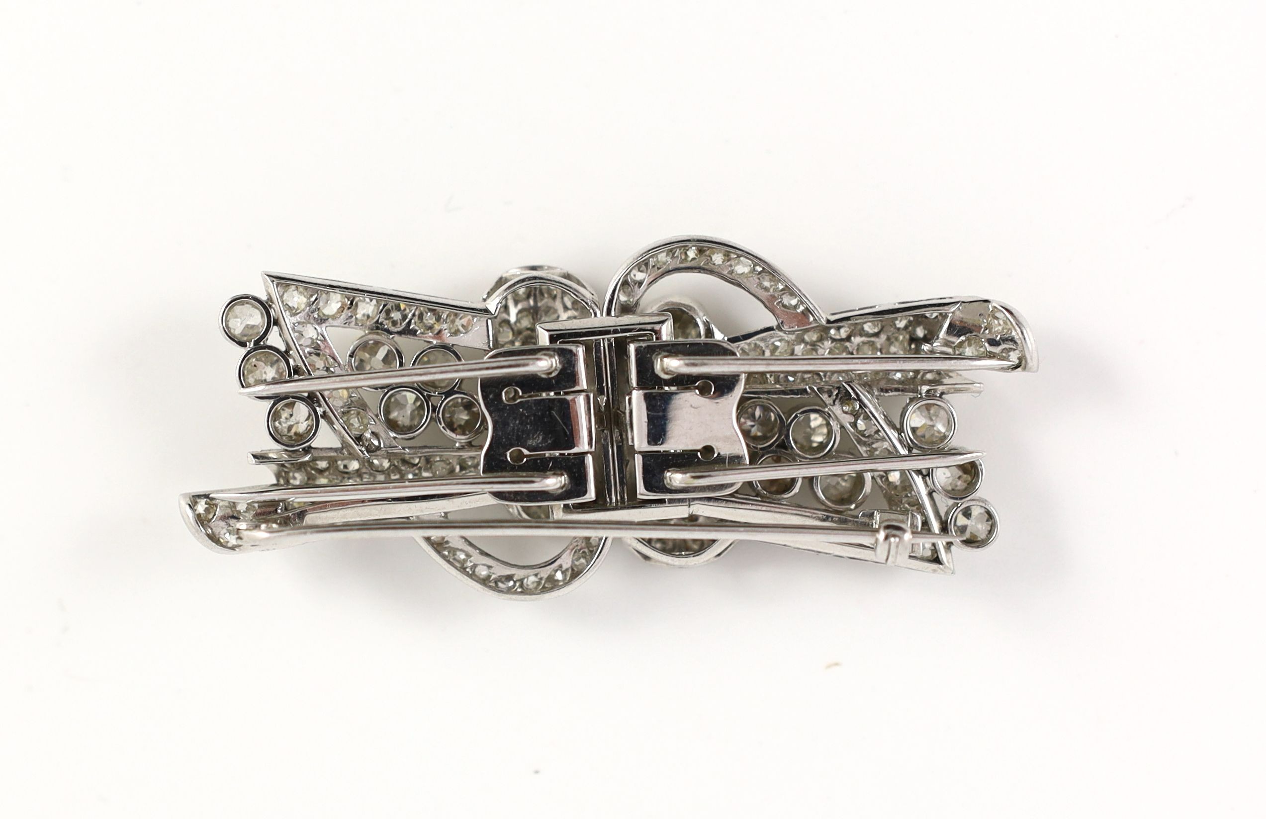A mid 20th century Art Deco platinum and diamond cluster detachable double clip brooch
